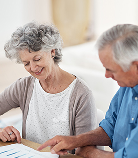 older couple looking at papers